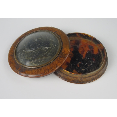 430 - A 19th Century Burr Wood and Tortoise Shell Lined Snuff Box decorated with an embossed plaque depict... 