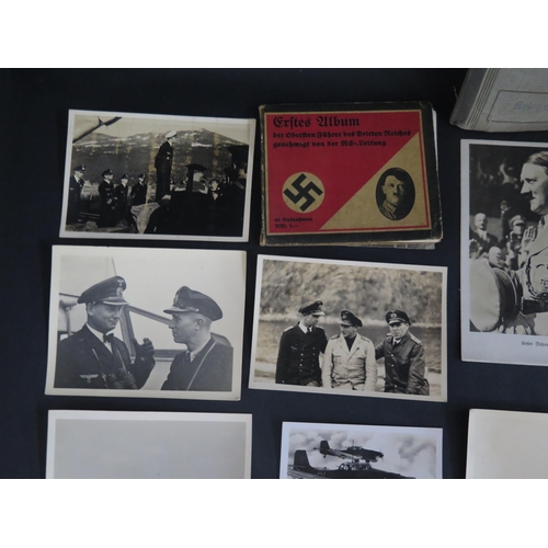 431 - A WWII German Passbook Sleeve containing a postcard of Adolf Hitler Kriegsmarine photographs of offi... 