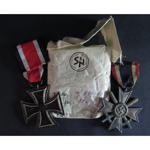 435 - A WWII German Iron Cross Second Class in paper sleeve and War Merit Cross Second Class