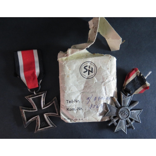 435 - A WWII German Iron Cross Second Class in paper sleeve and War Merit Cross Second Class