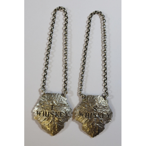 63 - A Pair of Edward VII Cast Silver Irish Whiskey and Scotch Whisky Leaf Shaped Bottle Labels, Birmingh... 