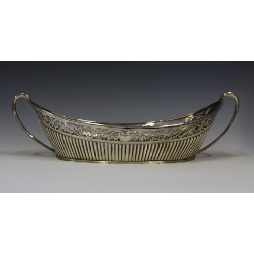 91 - A Victorian Silver Two Handled Bread Basket with gadrooned base and pierced and chased scrolling fol... 