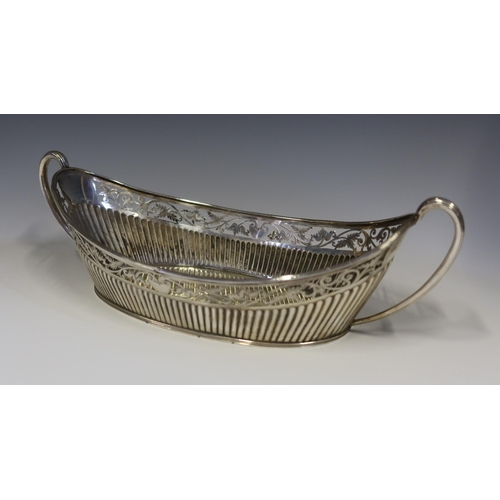 91 - A Victorian Silver Two Handled Bread Basket with gadrooned base and pierced and chased scrolling fol... 