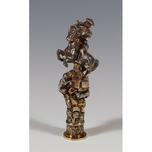 96 - A Cast Silver and Gilt Seal modelled as a rearing horse with rider blowing a bugle standing atop bat... 