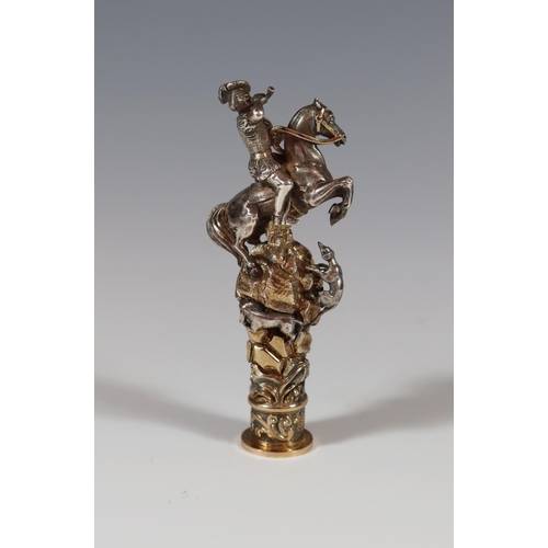 96 - A Cast Silver and Gilt Seal modelled as a rearing horse with rider blowing a bugle standing atop bat... 