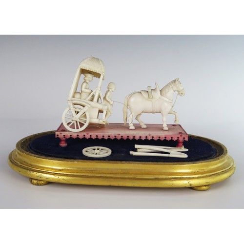 164 - A 19th Century Indian Carved Ivory Model of a Horse Drawn Carriage beneath a glass dome, dome 25(l) ... 