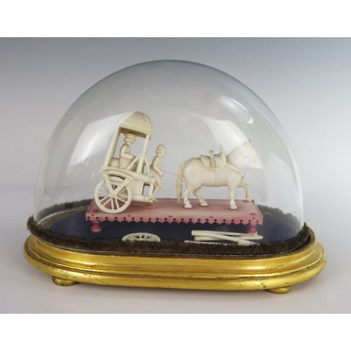 164 - A 19th Century Indian Carved Ivory Model of a Horse Drawn Carriage beneath a glass dome, dome 25(l) ... 