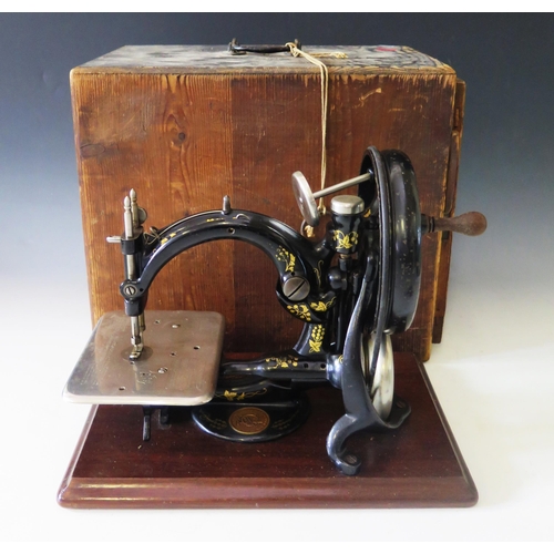 A Wilcox & Gibbs 1893 Patent Sewing Machine with instruction and