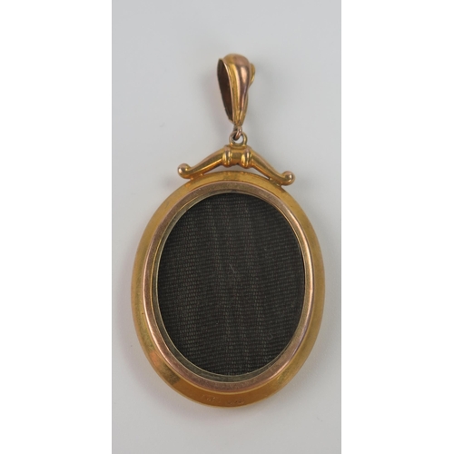 104 - 9ct Gold Locket with twin glazed panels, maker AJS, 52mm drop, 6.7g