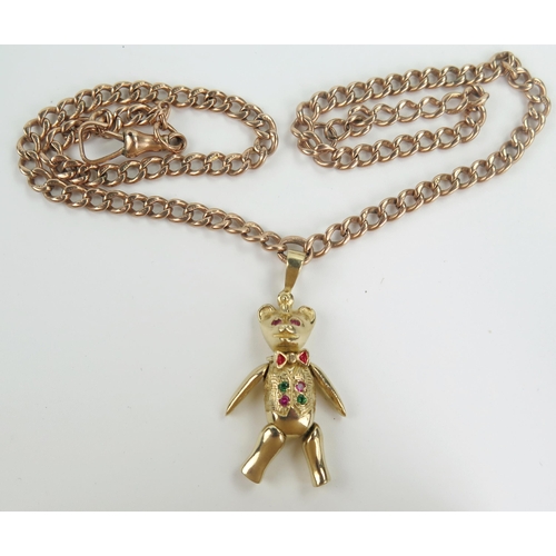 130 - 9ct Gold, Emerald and Ruby Bear Pendant with articulated head, arms and legs (c. 43mm drop) and on a... 