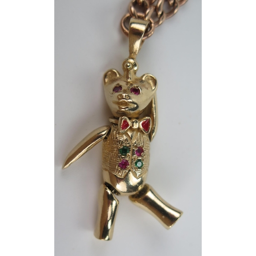 130 - 9ct Gold, Emerald and Ruby Bear Pendant with articulated head, arms and legs (c. 43mm drop) and on a... 