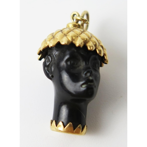 147A - Unmarked Yellow Metal and Ebony Head Charm, 3.2