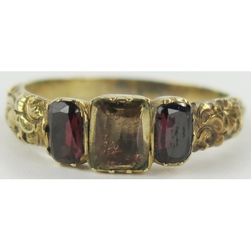 19 - A Georgian Foil Backed Garnet and Citrine? Three Stone Ring in an unmarked high carat gold setting w... 