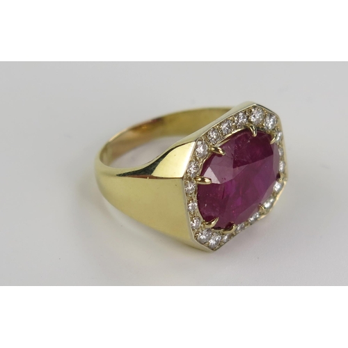 196 - Ruby and Diamond Ring in an unmarked high carat gold setting, central stone c. 14.7x11.8mm, size p. ... 