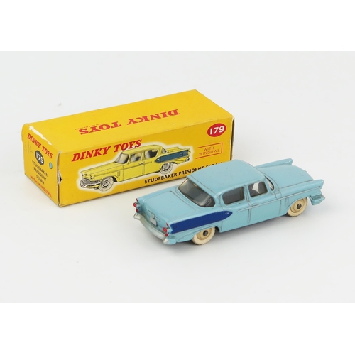 2073 - A Dinky Toys 179 Studebaker President Sedan in light blue with dark blue flash and cream hubs in cor... 