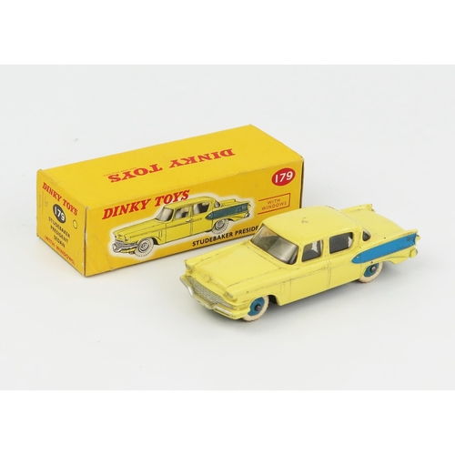 2074 - A Dinky Toys 179 Studebaker President Sedan in light yellow with blue flash and hubs in correct colo... 