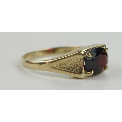 208 - A 9ct Yellow Gold and Garnet Ring, 9x7mm stone, size R, 3.3g