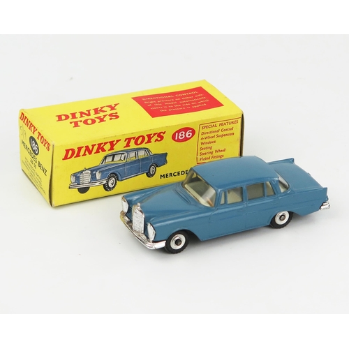 2084 - A Dinky Toys 186 Mercedes Benz 220 SE in RAF blue with off-white interior and gloss black base. Near... 