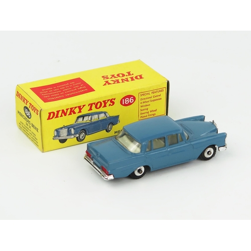 2084 - A Dinky Toys 186 Mercedes Benz 220 SE in RAF blue with off-white interior and gloss black base. Near... 