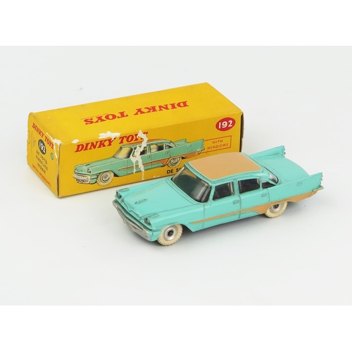 2092 - A Dinky Toys 192 De Soto Fireflite Sedan in turquoise with tan roof and flash, spun hubs and white t... 