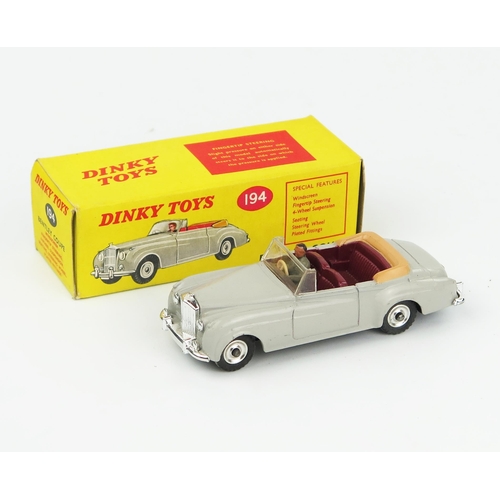 2094 - A Dinky Toys 194 Bentley S2 Coupe in grey with maroon interior, tan hood, grey male driver, spun hub... 