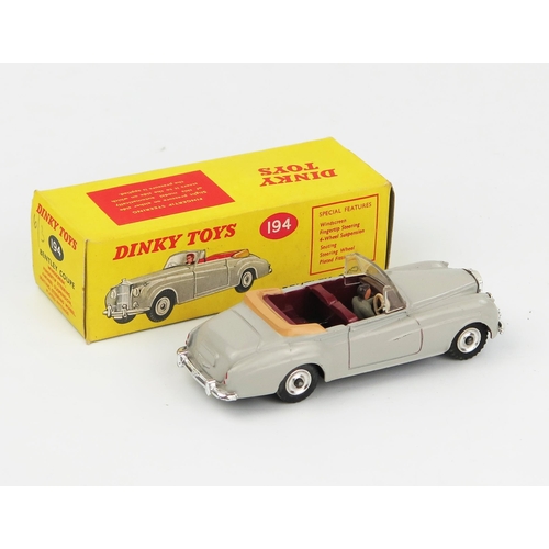 2094 - A Dinky Toys 194 Bentley S2 Coupe in grey with maroon interior, tan hood, grey male driver, spun hub... 