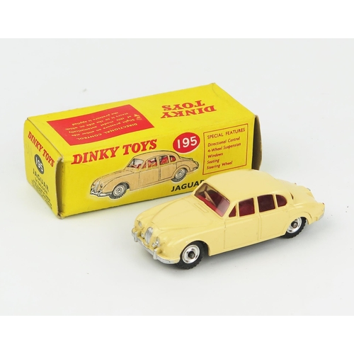 2095 - A Dinky Toys 195 Jaguar 3.4 Saloon in cream with red interior, spun hubs and gloss black base in lig... 