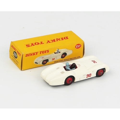 2102 - A Dinky Toys 237 Mercedes Benz Racing Car in white with red interior, hubs and RN '30', blue driver ... 