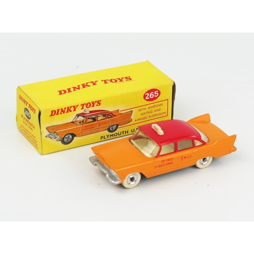 2105 - A Dinky Toys 265 Plymouth USA Taxi in yellow-orange with red roof, fare details in red on doors, off... 