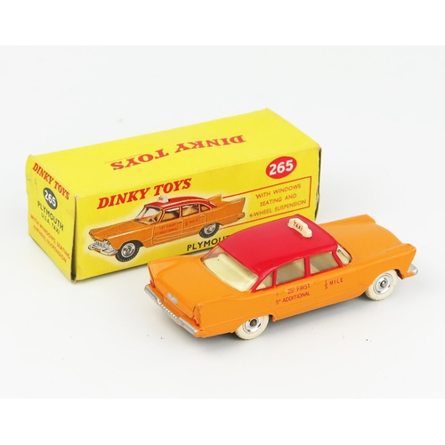 2105 - A Dinky Toys 265 Plymouth USA Taxi in yellow-orange with red roof, fare details in red on doors, off... 