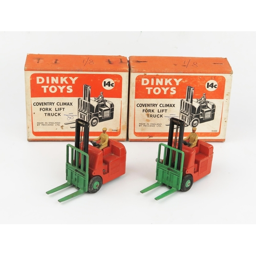 2108 - Two Dinky Toys 14c Coventry Climax Fork Lift Trucks in orange with green forks and hubs and fawn dri... 