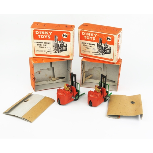 2108 - Two Dinky Toys 14c Coventry Climax Fork Lift Trucks in orange with green forks and hubs and fawn dri... 