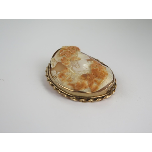 215 - Large 9ct Gold Shell Cameo Brooch decorated with the bust of a lady, 64x51mm, 23.4g