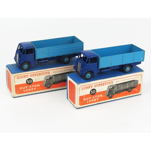 2164 - Two Dinky Supertoys 511 Guy 4-Ton Lorries 1st type cab, violet blue cab, chassis and wings, mid blue... 