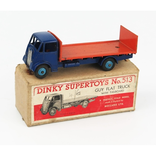 2168 - A Dinky Supertoys 513 Guy Flat Truck with tailboard type 1 cab, dark blue cab, wings and chassis, mi... 