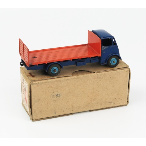 2168 - A Dinky Supertoys 513 Guy Flat Truck with tailboard type 1 cab, dark blue cab, wings and chassis, mi... 