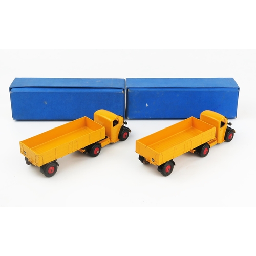 2181 - Two Dinky Supertoys 521 Bedford Articulated Lorries in yellow-orange with black wings and red hubs i... 