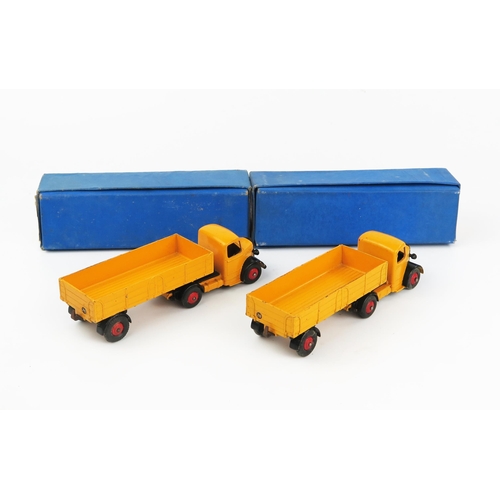 2182 - Two Dinky Supertoys 521 Bedford Articulated Lorries in yellow-orange with black wings and red hubs i... 