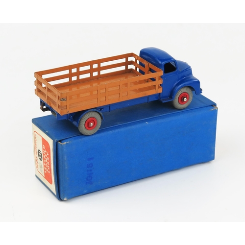 2188 - A Dinky Supertoys 531 Leyland Comet Lorry with Stake Body in dark blue with brown back, red hubs and... 