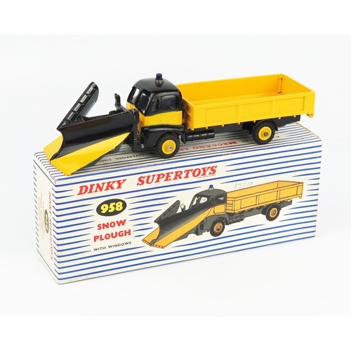 2213 - A Dinky Supertoys 958 Snow Plough in black and yellow  with matching plough blade, blue light and ye... 