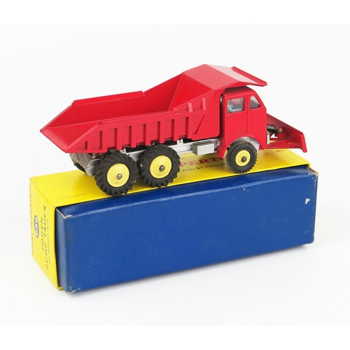 2214 - A Dinky Supertoys 959 Foden Dump Truck in red with silver chassis and blade with pale yellow plastic... 