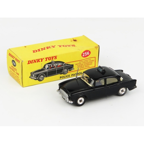 2230 - A Dinky Toys Humber Hawk Police Car in black with cream interior and spun hubs. Near mint but the ro... 