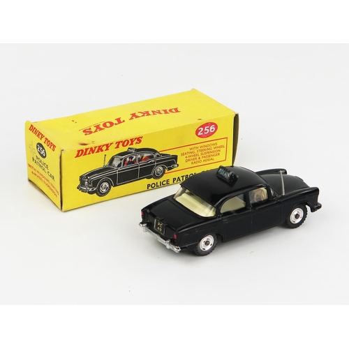 2230 - A Dinky Toys Humber Hawk Police Car in black with cream interior and spun hubs. Near mint but the ro... 