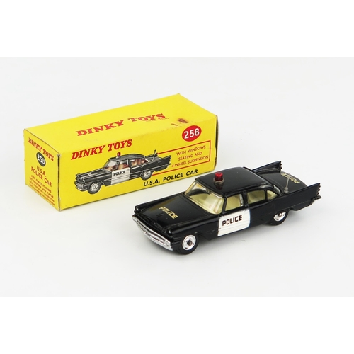 2232 - A Dinky Toys 258 Desoto Police Car in black with cream interior and red roof light. Excellent/near m... 