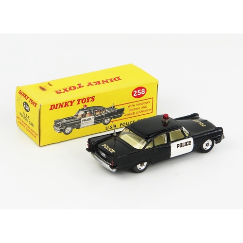 2232 - A Dinky Toys 258 Desoto Police Car in black with cream interior and red roof light. Excellent/near m... 