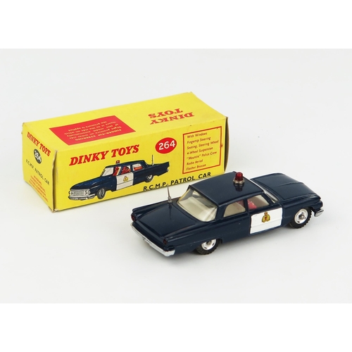 2234 - A Dinky Toys 264 Ford Fairlane RCMP Patrol Car in dark blue with white doors and interior, spun hubs... 