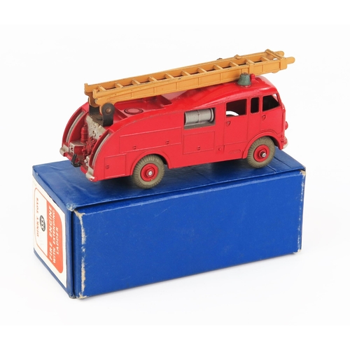 2238 - A Dinky Toys 555 (Commer) Fire Engine with Extending Ladder in red with tan ladder, no windows, red ... 