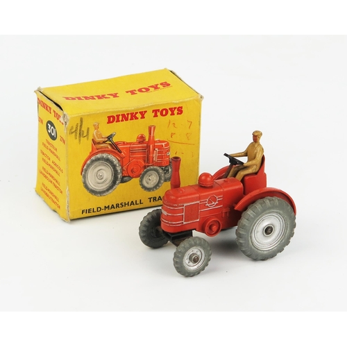 2244 - A Dinky Toys 27N/301 Field Marshall Tractor in burnt orange body and exhaust, silver cast wheels and... 