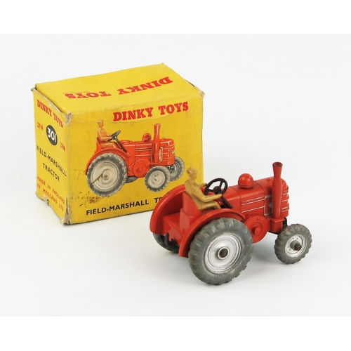 2244 - A Dinky Toys 27N/301 Field Marshall Tractor in burnt orange body and exhaust, silver cast wheels and... 