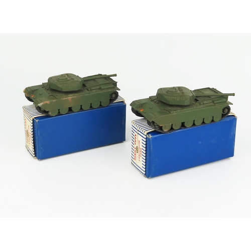 2260 - Two Dinky Toys 651 Centurion Tanks with metal rollers with blue/white stripe boxes. Both with rust i... 